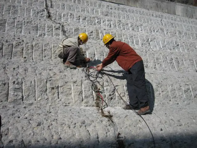 Dam repair by microfine cement